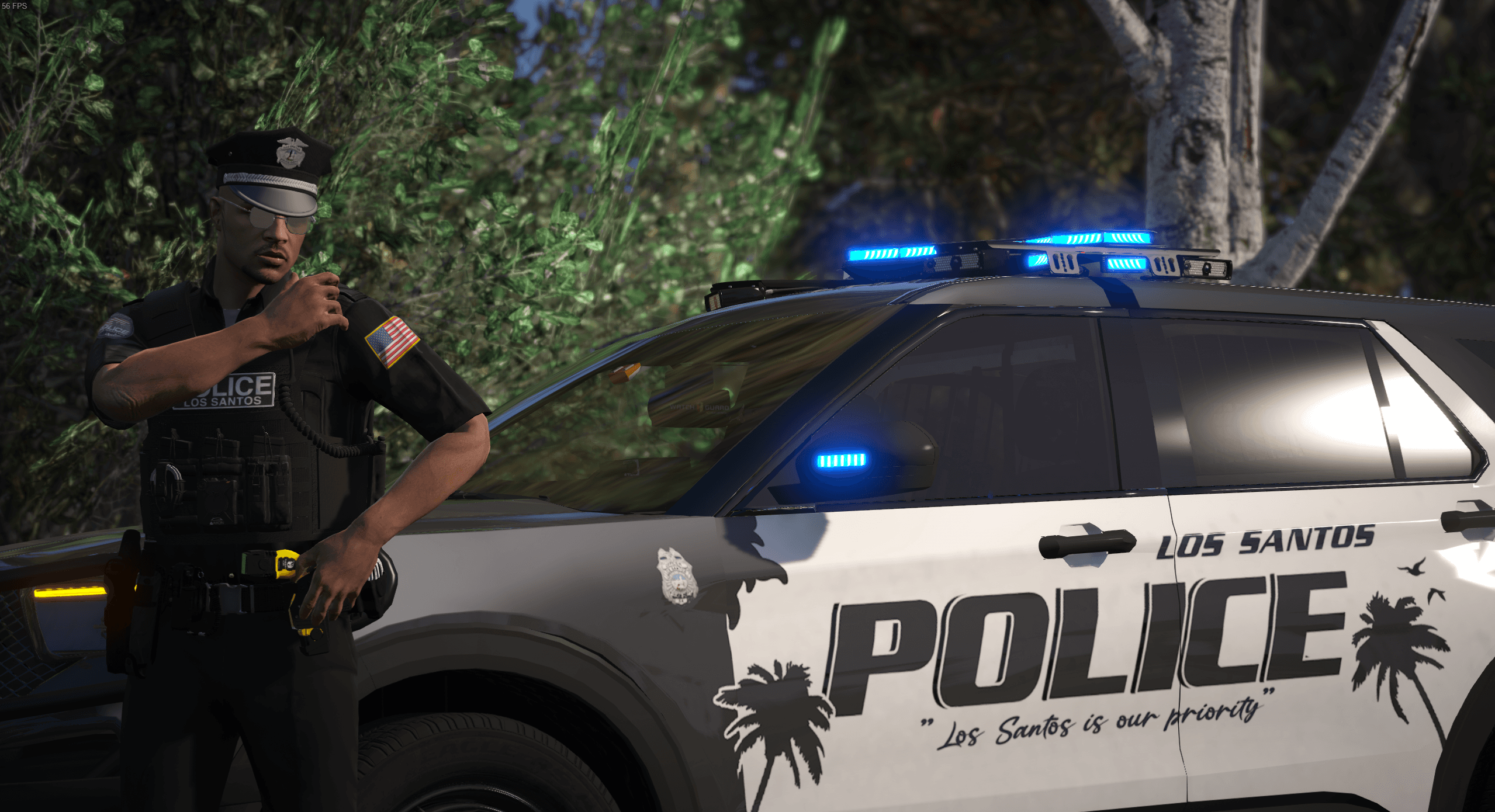 Los Santos police officer beside a patrol vehicle